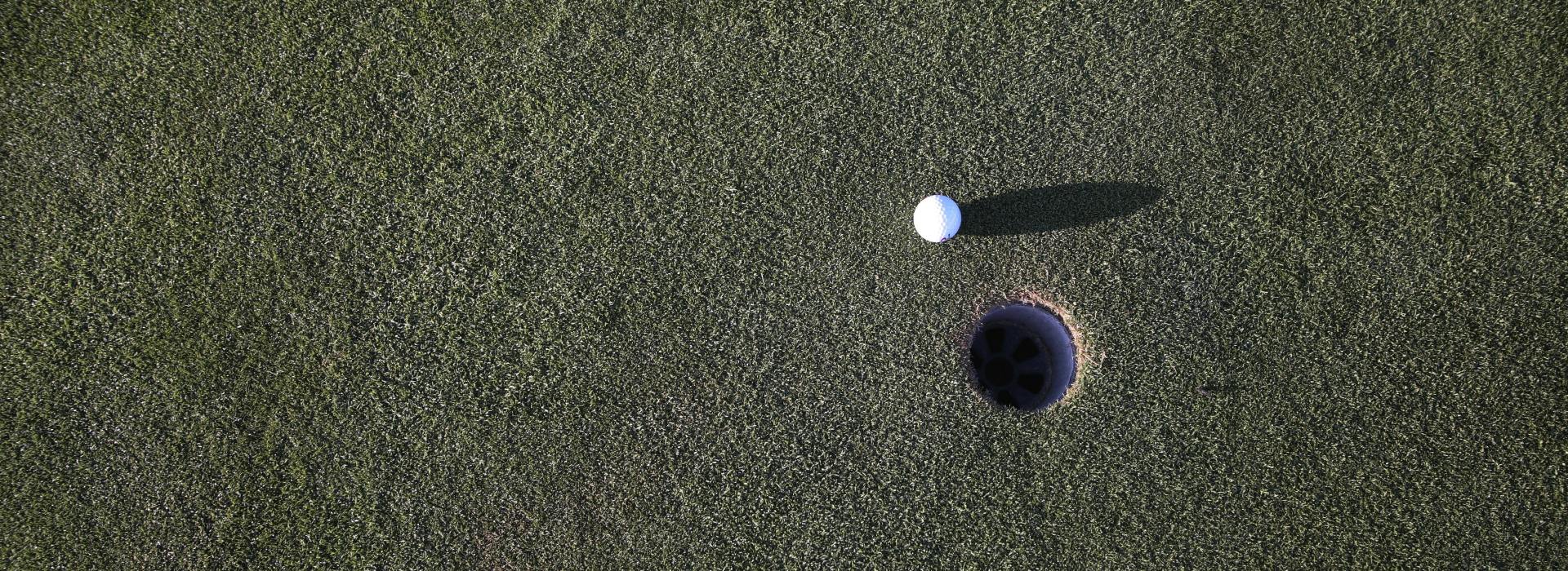 Golf ball near hole